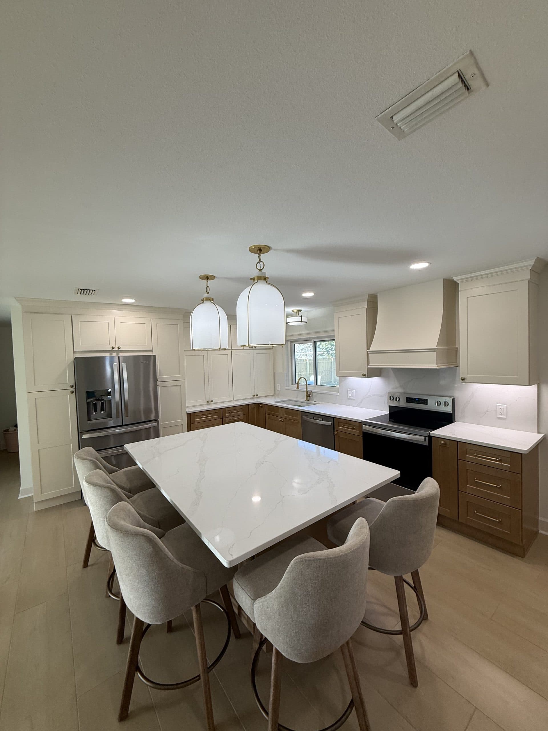 Two-tone kitchen remodel with quartz island — Tampa Bay