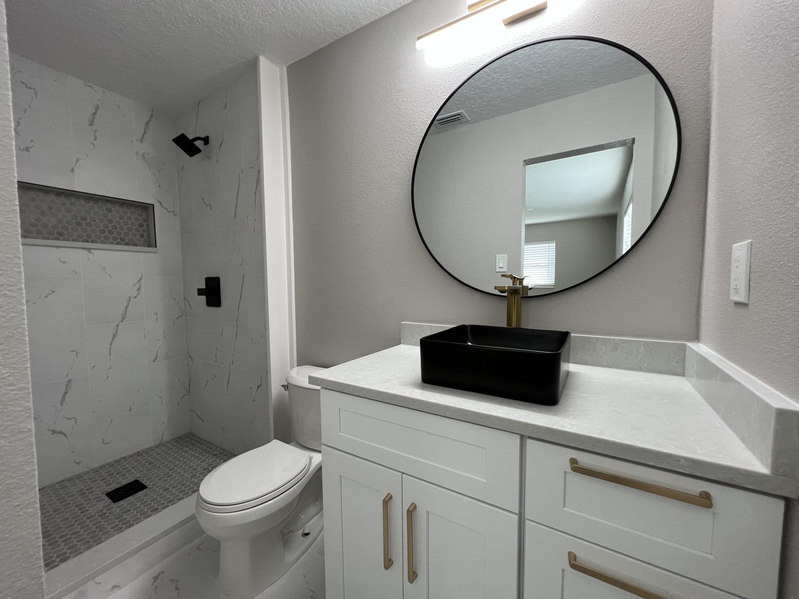 Modern master bathroom with vessel sink and marble shower by Crafted Kitchen and Bath